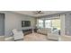 Spacious living room with large windows and access to patio at 6206 Windship Ct, Tampa, FL 33647