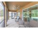 Spacious screened-in porch with wicker furniture at 6206 Windship Ct, Tampa, FL 33647