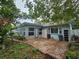 Brick patio and sunroom add to this home's outdoor space at 7711 Innis Ct, St Petersburg, FL 33709