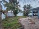 Brick patio and grassy yard create relaxing outdoor space at 7711 Innis Ct, St Petersburg, FL 33709