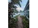 Brick pathway alongside a fence and tropical plants at 7711 Innis Ct, St Petersburg, FL 33709
