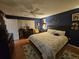 Comfortable bedroom with king-size bed and built-in dresser at 7711 Innis Ct, St Petersburg, FL 33709