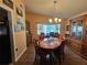 Spacious dining area, hardwood floors, and large window at 7711 Innis Ct, St Petersburg, FL 33709