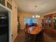 Dining area with hardwood floors, oval table and buffet at 7711 Innis Ct, St Petersburg, FL 33709