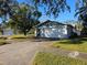 Ranch-style home with attached garage and spacious yard at 7711 Innis Ct, St Petersburg, FL 33709