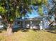 Ranch style home with mature landscaping and covered porch at 7711 Innis Ct, St Petersburg, FL 33709