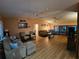 Bright living room featuring hardwood floors and comfy furniture at 7711 Innis Ct, St Petersburg, FL 33709