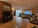 Living area with hardwood floors, L-shaped sofa and seating at 7711 Innis Ct, St Petersburg, FL 33709