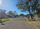 Residential street showcasing several single Gathering homes at 7711 Innis Ct, St Petersburg, FL 33709