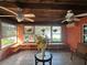 Sunroom with tiled floors, wood ceiling, and plenty of natural light at 7711 Innis Ct, St Petersburg, FL 33709
