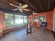 Sunroom with tiled floors, wood ceiling, and sliding glass doors at 7711 Innis Ct, St Petersburg, FL 33709