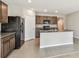 Modern kitchen with granite countertops and island at 9905 Warm Stone St, Thonotosassa, FL 33592