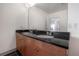 Bathroom with double vanity and dark countertop at 1010 Central Ave # 106, St Petersburg, FL 33705