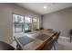 Breakfast nook features a wood table with gray chairs, overlooking the pool at 1010 Central Ave # 106, St Petersburg, FL 33705