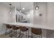 Modern community kitchen with stainless steel appliances and bar seating at 1010 Central Ave # 106, St Petersburg, FL 33705