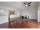 Open dining area with hardwood floors and ceiling fan at 1010 Central Ave # 106, St Petersburg, FL 33705