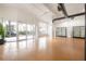 Open retail space with wood floors, display cases, and large windows at 1010 Central Ave # 106, St Petersburg, FL 33705