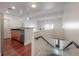 Open kitchen with stainless steel appliances and hardwood floors at 1010 Central Ave # 106, St Petersburg, FL 33705