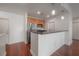 Modern kitchen with island and hardwood floors at 1010 Central Ave # 106, St Petersburg, FL 33705