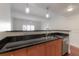 Modern kitchen with breakfast bar and hardwood floors at 1010 Central Ave # 106, St Petersburg, FL 33705
