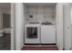 Bright laundry room with washer and dryer and ample shelving at 1010 Central Ave # 106, St Petersburg, FL 33705