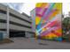 Convenient parking garage access with vibrant mural at 1010 Central Ave # 106, St Petersburg, FL 33705