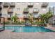 Resort-style pool with lounge chairs and a surrounding patio at 1010 Central Ave # 106, St Petersburg, FL 33705