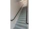 Clean, modern staircase with metal railings at 1010 Central Ave # 106, St Petersburg, FL 33705