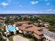 Aerial view of community clubhouse, pool, and surrounding area at 1112 Jasmine Creek Ct, Sun City Center, FL 33573