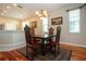 Elegant dining room with hardwood floors and ornate dining set at 1112 Jasmine Creek Ct, Sun City Center, FL 33573