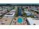 Aerial view of community pool and canal at 112 Saint Pierres Way, Apollo Beach, FL 33572