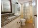Clean bathroom with granite countertop and bathtub at 112 Saint Pierres Way, Apollo Beach, FL 33572