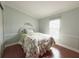 Bright bedroom with wood floors and a comfortable bed at 112 Saint Pierres Way, Apollo Beach, FL 33572