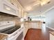 Modern kitchen with granite countertops and white cabinets at 112 Saint Pierres Way, Apollo Beach, FL 33572