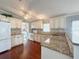 Large kitchen with granite countertops and ample cabinet space at 112 Saint Pierres Way, Apollo Beach, FL 33572