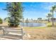 Serene pond with fountain and bench at 112 Saint Pierres Way, Apollo Beach, FL 33572