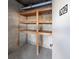 Private storage unit with wooden shelving at 11730 Shipwatch Dr # 702, Largo, FL 33774