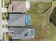 Aerial view of two homes with pools and a shared backyard at 1312 Brooke View Dr, Odessa, FL 33556