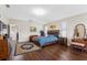 Main bedroom with comfy bed, dark wood floors and vanity at 1312 Brooke View Dr, Odessa, FL 33556