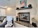 Living room fireplace with decorative accents at 17960 Gulf Blvd # 103, Redington Shores, FL 33708