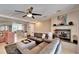 Spacious living room with gray sectional sofa and fireplace at 17960 Gulf Blvd # 103, Redington Shores, FL 33708