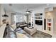 Spacious living room with leather sofas and built-in entertainment center at 17960 Gulf Blvd # 103, Redington Shores, FL 33708