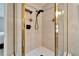 Large walk-in shower with tile surround and glass door at 17960 Gulf Blvd # 103, Redington Shores, FL 33708