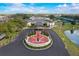 Community center with Veteran's Memorial and surrounding landscape at 1928 E View Dr, Sun City Center, FL 33573
