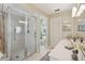 Bathroom features a shower, toilet and double vanity at 1928 E View Dr, Sun City Center, FL 33573