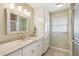 Updated bathroom with granite countertop and walk-in shower at 1928 E View Dr, Sun City Center, FL 33573