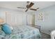 Guest bedroom with ceiling fan and plenty of closet space at 1928 E View Dr, Sun City Center, FL 33573