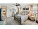 Primary bedroom with ceiling fan and large windows at 1928 E View Dr, Sun City Center, FL 33573