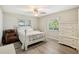 Bright bedroom featuring a white bed frame and ample natural light at 1928 E View Dr, Sun City Center, FL 33573