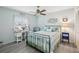 Guest bedroom with a ceiling fan and a comfortable bed at 1928 E View Dr, Sun City Center, FL 33573